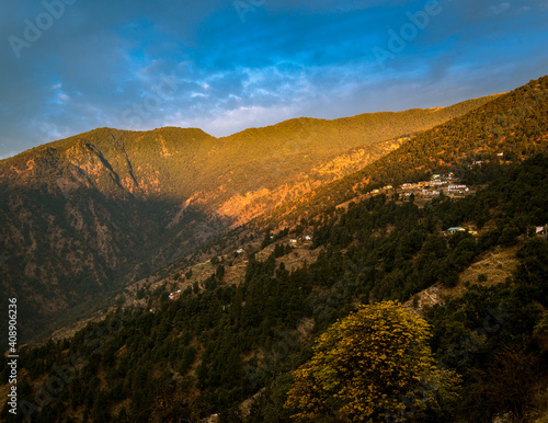 Sunset over the mountains. Scenic valley in the lap of Himalayan mountain forest, Uttarakhand, India.