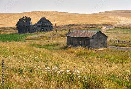 Abandoned Farmhouse and Barn Palouse Washington State. Abandoned buildings dot the landscape in the Palouse area of Washington State, USA.

