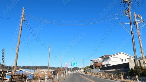 Car window image of the national highway along the sea