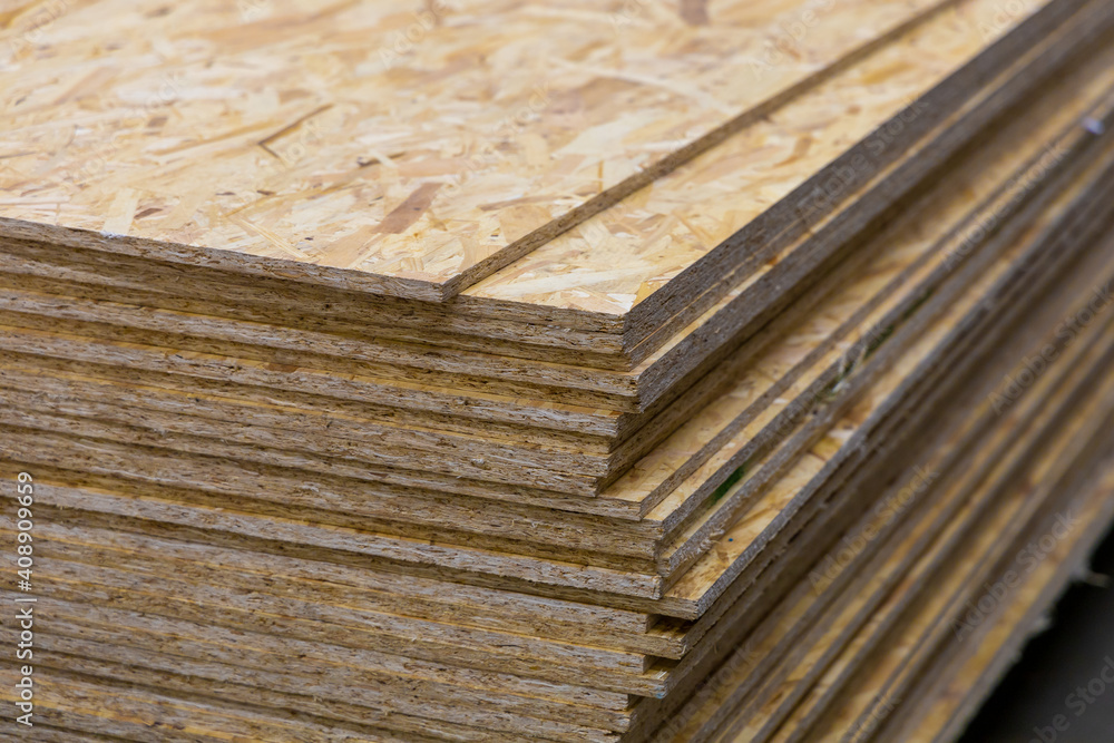 OSB Oriented Strand Board. Sheet stack in a construction store. Engineered wood product for