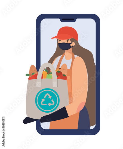 online ordering and delivery woman with safety mask and one ecobag full of market products on phone