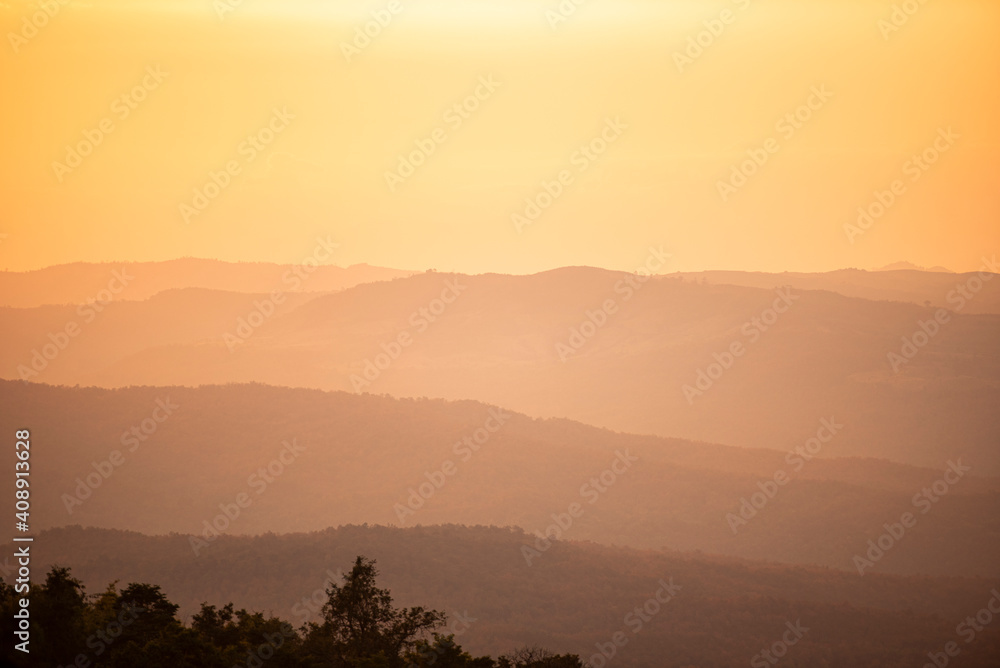 View sunset on mountain with hill warm light sun, Beautiful landscape tree nature sunrise.