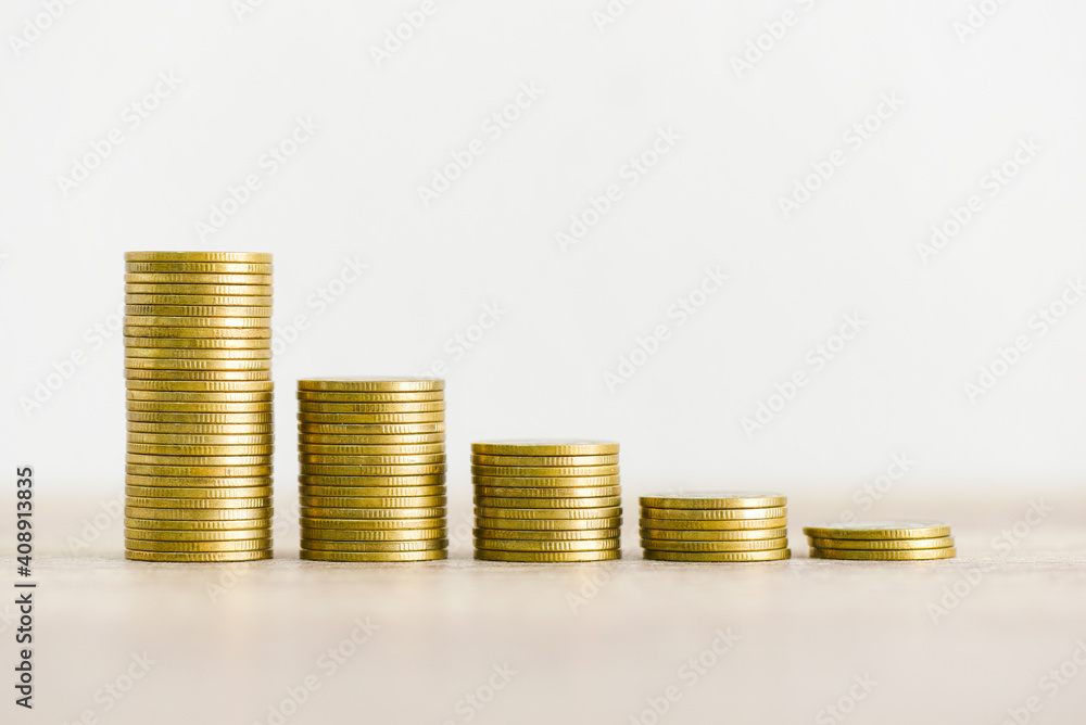Golden coins stack on wooden table background, stack of coins financial growth ladder and business Golden coins stack on wooden table background, stack of coins financial growth ladder and business