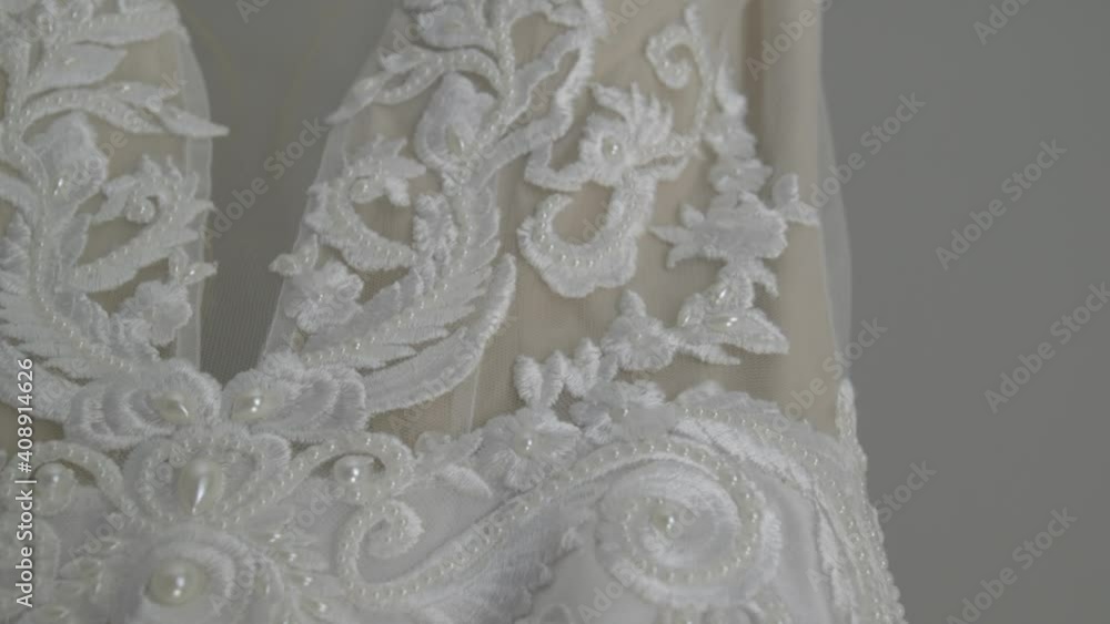 Close up of a beautiful wedding dresses in a bridal salon Close up of a beautiful wedding dresses in a bridal salon