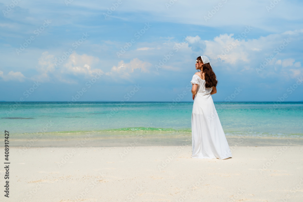 cheerful woman on sea beach at Koh MunNork Island, Rayong, Thailand cheerful woman on sea beach at Koh MunNork Island, Rayong, Thailand