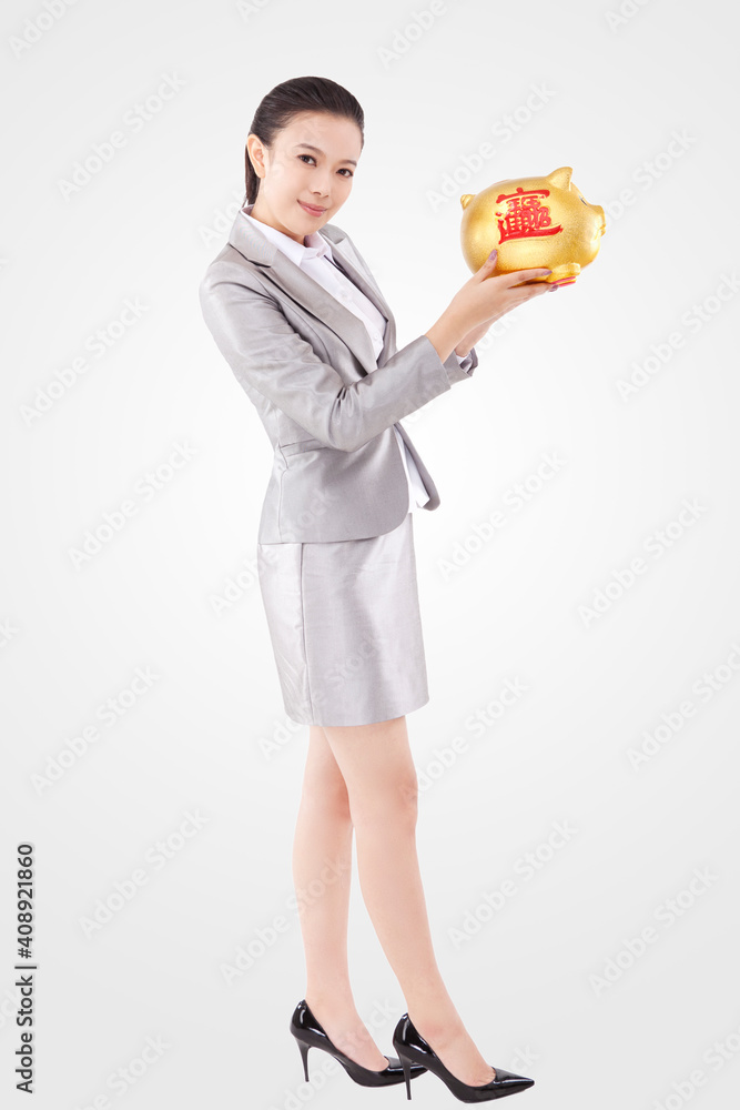 Oriental business woman and piggy bank Oriental business woman and piggy bank