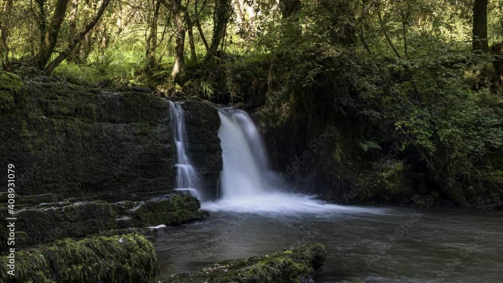 Time lapse of forest waterfall in rural landscape during autumn in Ireland. Time lapse of forest waterfall in rural landscape during autumn in Ireland.
