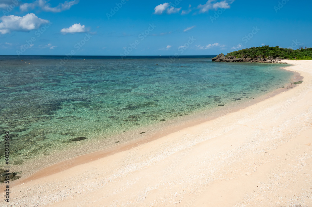Beautiful translucent emerald green sea full of corals, nice sands on the serene Mimikiri beach. Iriomote Island.