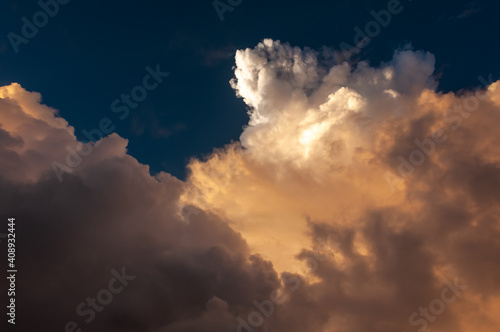 Colored clouds formation illuminated by a magic sunlight. Cumulunimbus.