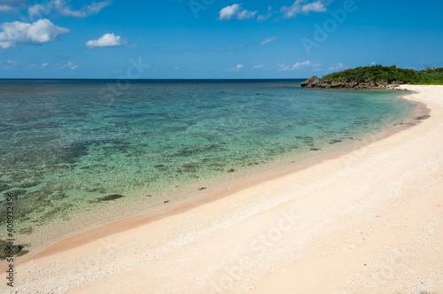 Beautiful translucent emerald green sea full of corals, nice sands on the serene Mimikiri beach. Iriomote Island.