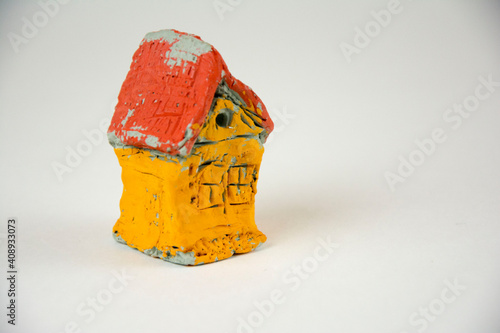 decorative clay house with a white background