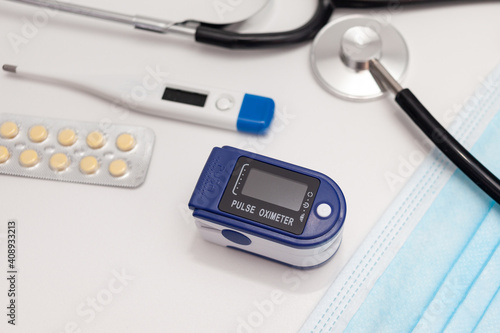 Medical equipment on the doctor's desk. Oximeter and other equipment