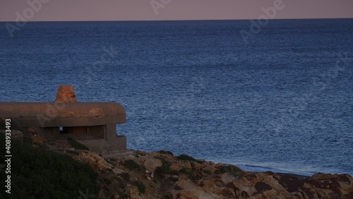 War bunker on the beach coast, Spain photo