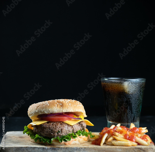 Hamburger meal served with french fries and soda. Fast food