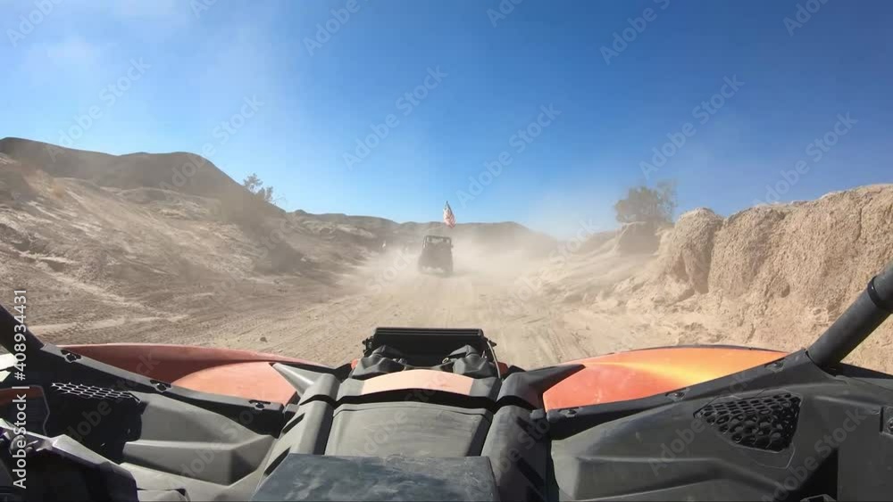 Driving and Offroad vehicle down a desert road Driving and Offroad vehicle down a desert road