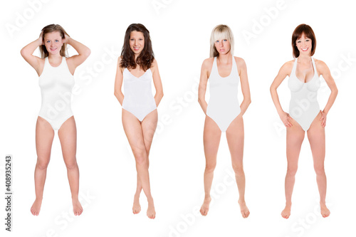 Full length portraits of four slim young women wearing white bathing suits, isolated on neutral studio background
