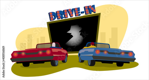 Drive-in cinema. Drive-in theater. Open space auto theater with movie going on, cars parked nearby, city behind.