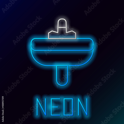 Glowing neon line Washbasin with water tap icon isolated on black background. Colorful outline concept. Vector.