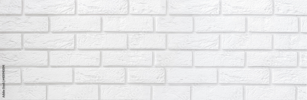 Fototapeta premium A white brick wall. Copy space for text. Banner