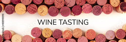 Wine tasting panoramic banner. Many wine corks, shot from the top on a white background