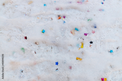 abstract background on the theme of the holiday with confetti on the snow