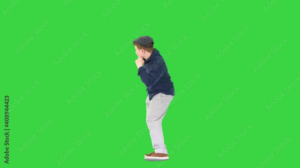 Happy stylish boy doing some cool dancing on a Green Screen, Chroma Key. Happy stylish boy doing some cool dancing on a Green Screen, Chroma Key.