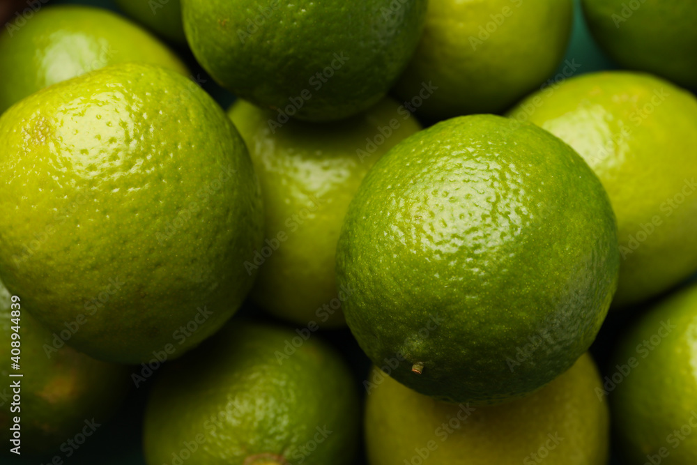 Fresh ripe lime on whole background, close up Fresh ripe lime on whole background, close up