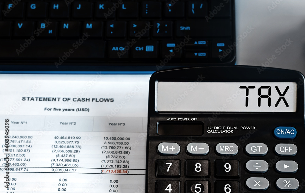 Calculator with the word TAX on the display Calculator with the word TAX on the display