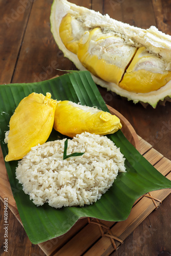 Ketan duren or ketan durian is indonesian traditional cuisine made from glutinuous rice, coconut milk, and durian. photo