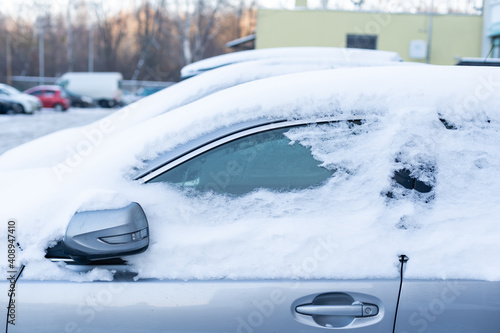 Cars covered with snow, car windows in the snow