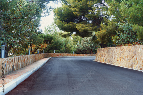 Picturesque concrete slope walkway with plants on the sides