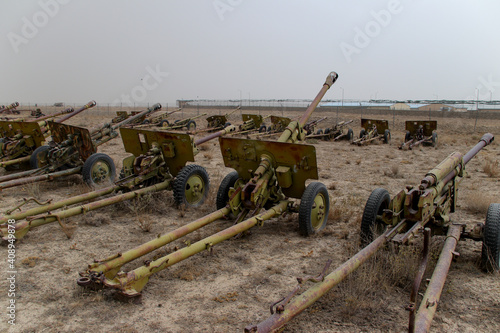 Old armoured vehicles military escorts, guns and tanks in Gardez in Afghanistan photo