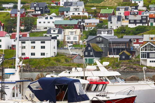 Picturesque colorful village and harbor of Sandavagur. Faroe islands coastline photo