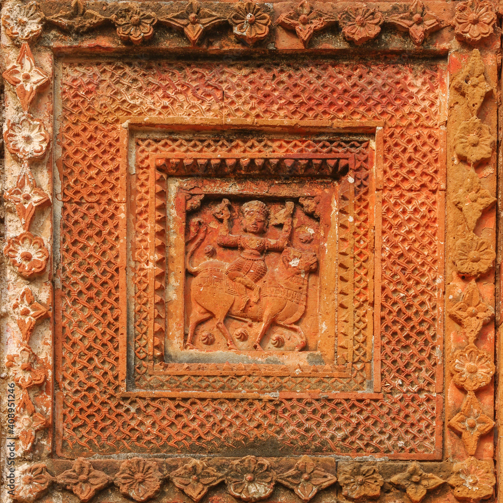 Carved terracotta scene of Durga riding Nandi bull  on beautiful ancient Chauchala Chhota Govinda Mandir in Puthia temple complex, Rajshahi district, Bangladesh