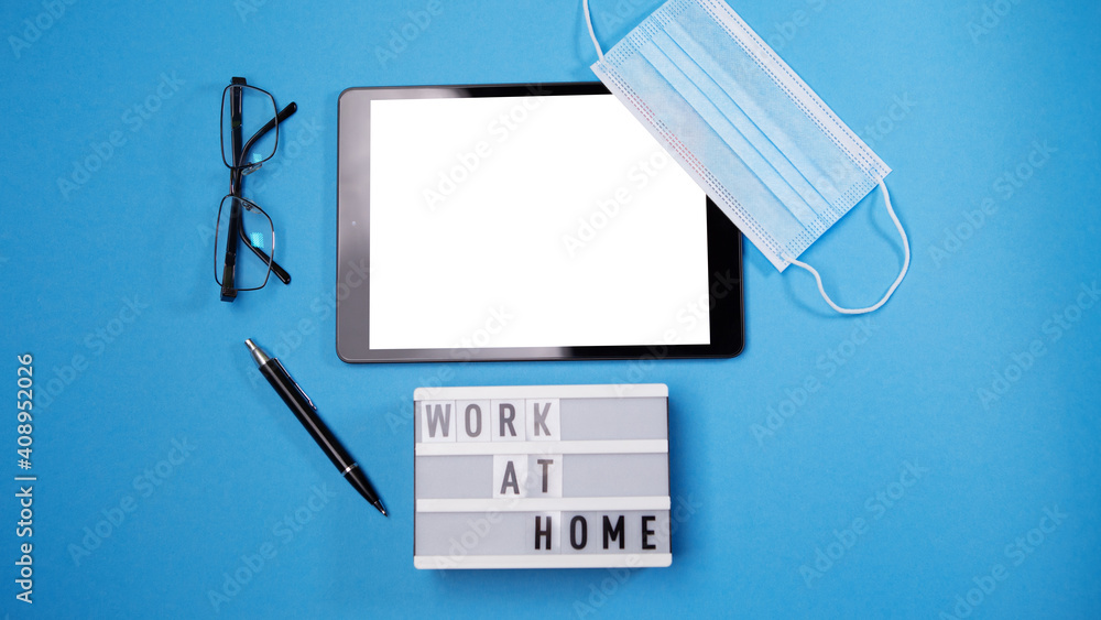 Flat lay mock up tablet pc white blank screen isolated blue background. Digital modern gadget, remote distance work concept. Face travel surgical hygienic disposable mask. Work at home concept.
Flat lay mock up tablet pc white blank screen isolated blue background. Digital modern gadget, remote distance work concept. Face travel surgical hygienic disposable mask. Work at home concept.