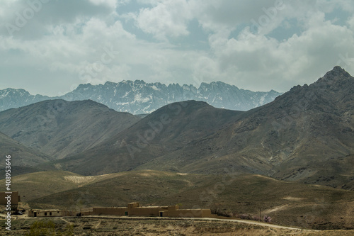 Old armoured vehicles military escorts, guns and tanks in Gardez in Afghanistan photo