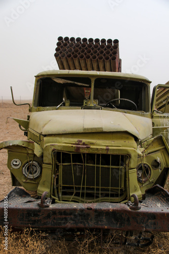 Old armoured vehicles military escorts, guns and tanks in Gardez in Afghanistan photo