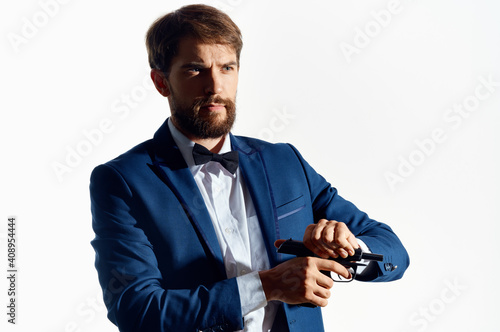 man in suit holding a gun detective crime isolated background