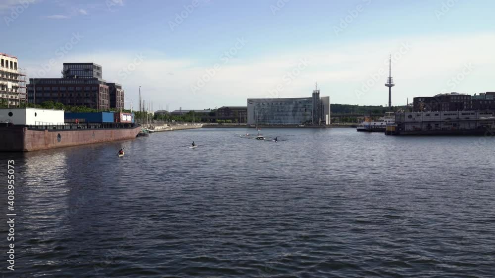 port of Kiel, Germany with blue sky and canoes in the water port of Kiel, Germany with blue sky and canoes in the water