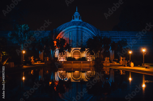 The botanical garden in Balboa park in San Diego, California is reflected in the lily pond