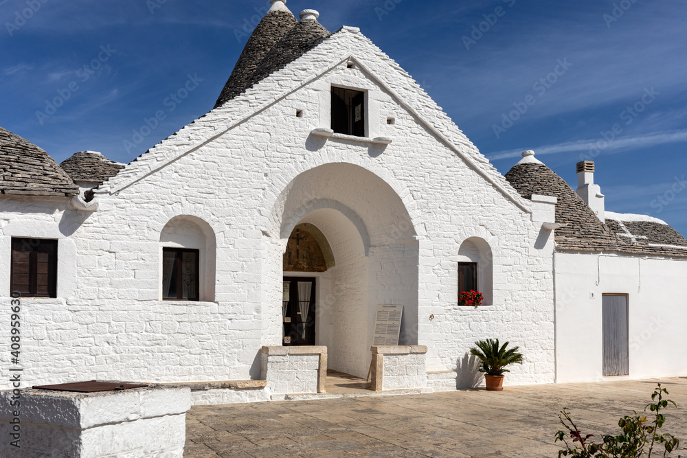  Trulli village in Alberobello, Italy. The style of construction is specific to the Murge area of the Italian region of Apulia (in Italian Puglia). Made of limestone and keystone.