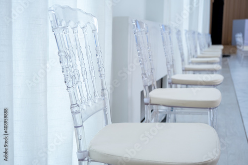 Clear plastic chiavari chairs in vintage style at weddings or events that maintain social distance and prevent the spread of COVID-19.