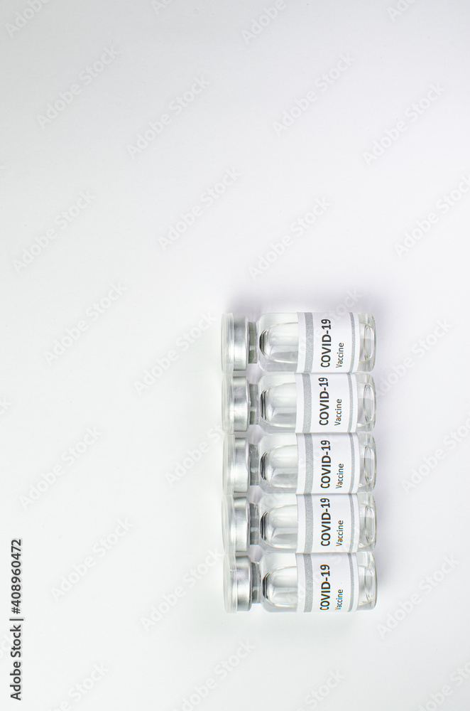 Coronavirus vaccine bottle flipped isolated on black background. Covid-19 situation disease pharmacy in laboratory and drug to cure people. Healthcare and Medical concept. Development of research. Coronavirus vaccine bottle flipped isolated on black background. Covid-19 situation disease pharmacy in laboratory and drug to cure people. Healthcare and Medical concept. Development of research.