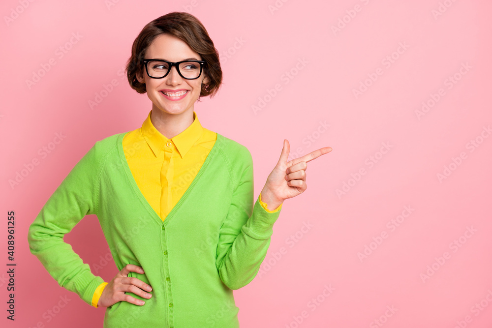 Photo of pretty brunette bob haired woman wear green shirt point look empty space isolated on pink color background Photo of pretty brunette bob haired woman wear green shirt point look empty space isolated on pink color background