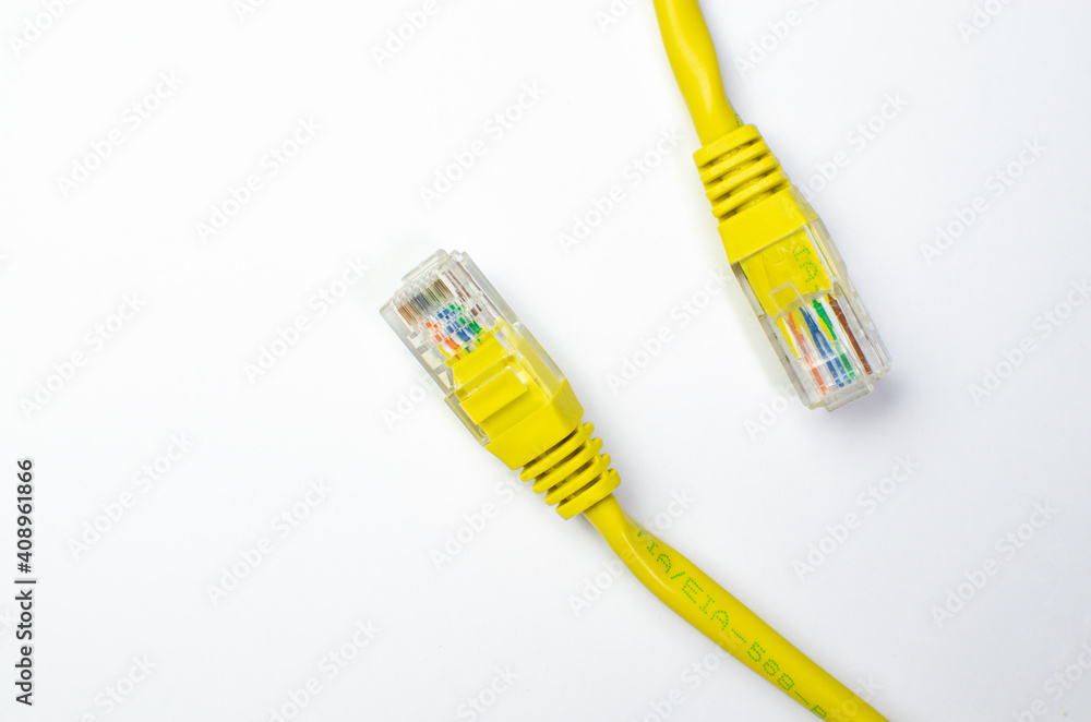 Cable plug Lan ethernet about electronic communication and computer equipment yellow on white background Cable plug Lan ethernet about electronic communication and computer equipment yellow on white background