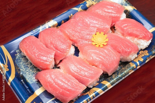 Closed up of tuna sushi set on plastic plate. Take home set. Japanese traditional food 