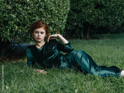 Pretty woman lies on the grass green bush nature fresh air charm elegant style © SHOTPRIME STUDIO