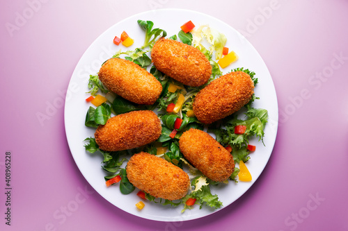 Traditional spanish croquettes tapas with avocado. Veggie tapa.