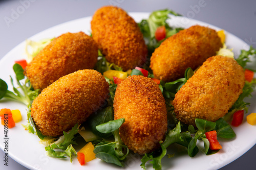 Quadro em tela Traditional spanish croquettes tapas with avocado. Veggie tapa.