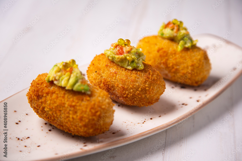 Traditional spanish croquettes tapas with avocado. Veggie tapa. Traditional spanish croquettes tapas with avocado. Veggie tapa.